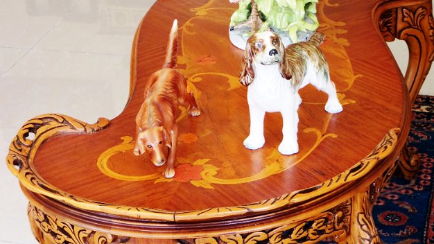 Center Table In excellent condition a Louis XV style center table heavily carved and with marquetry, with a size of 48 inches long...