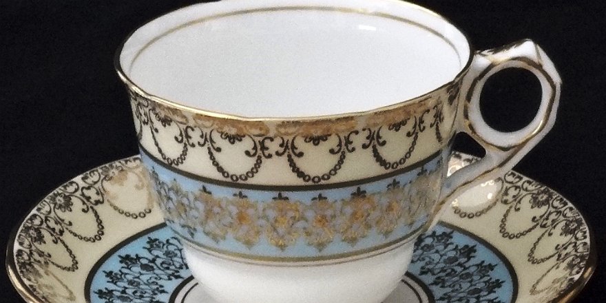 Cup - Taza Royal Stafford a set with cup and plate hand painted inlight brown and blue, with gold borders. Royal Stafford un juego de taza y plato pintados a mano en color...